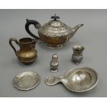 A silver teapot (422.