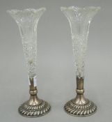 A pair of silver mounted cut glass bud vases