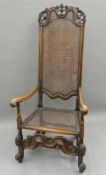 A 17th century style caned open armchair