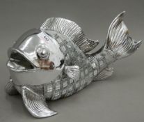 A mirrored silver coloured model of a fish