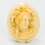 A 19th century carved ivory brooch Worked as a female bust. 5.25 cm high.