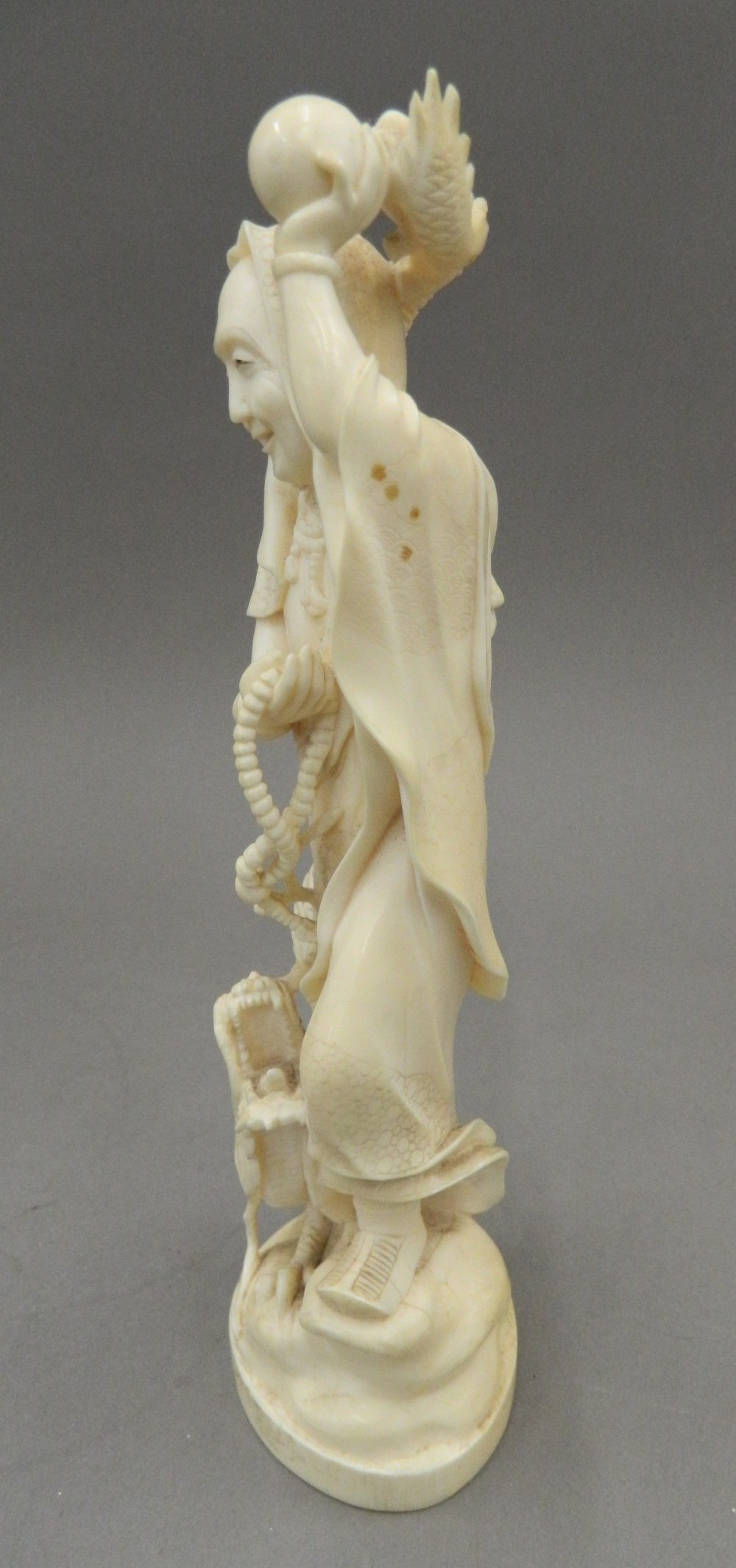 A late 19th century Japanese carved okimono Formed as a robed figure and a dragon, - Image 5 of 13