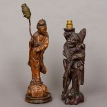 A 19th century Chinese wooden figural carving modelled as Guanyin With glass bead inset eyes,