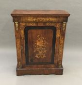 A Victorian kingwood crossbanded walnut gilt metal mounted pier cabinet The rectangular top above a