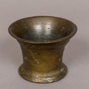 A 17th/18th century bronze heraldic mortar Of typical waisted cylindrical form,