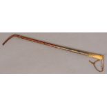 A late 19th/early 20th century crocodile skin mounted rhino horn riding crop Of typical form,
