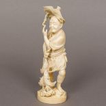 A late 19th century Japanese ivory okimono Formed as a fisherman with his catch,