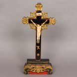 A 19th century Chinese painted naively carved bone crucifix Set with a bone Christ wearing a tied