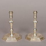 A pair of 18th century style silver taper sticks, hallmarked London 1996,
