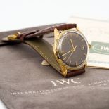 A 1960s IWC 18 ct gold grey dial gentleman's wristwatch With original guarantee and certificate of