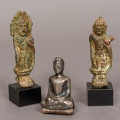 A small silver cased figure of Buddha Modelled seated;