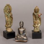 A small silver cased figure of Buddha Modelled seated;