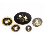 A collection of five pietra dura inset brooches The largest 9 cm wide.