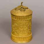 An ornate 19th century gilded copper canister and cover Decorated with an elaborate snake finial.