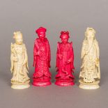 Four 19th century Chinese carved ivory chess pieces Two red stained. The largest 10.5 cm high.