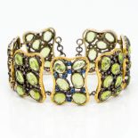 A peridot and sapphire set unmarked gold and diamond bracelet 17.5 cm long.
