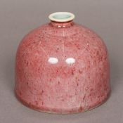 A Chinese porcelain peach bloom water pot Of typical domed form,