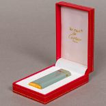 A Must de Cartier cigarette lighter Housed in original plush lined box. 7 cm high.