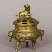 A 19th century Chinese bronze censer The removable pierced domed lid surmounted with a dog-of-fo,