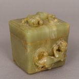 A Chinese carved jade box of chamfered tapering rectangular form Carved with three dragons. 8.