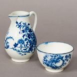 A Worcester blue and white porcelain jug Decorated with floral sprays in a fenced garden;