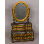 A late 18th/early 20th century chinoiserie lacquered dressing table mirror The oval plate supported