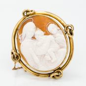 A 19th century unmarked gold cameo brooch Centred with the Madonna and child with an angel looking