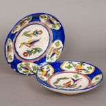 Two Persian pottery dishes Each decorated to the interior with birds. The larger 25 cm diameter.