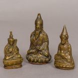 Three small bronze figures of Tibetan priests With sealed bases. The largest 9 cm high.