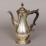 A George II silver coffee pot, possibly hallmarked for London 1775,