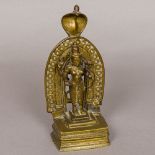 A bronze figure of Vishnu The four-armed deity with a hooded cobra back plate. 21.5 cm high.