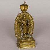 A bronze figure of Vishnu The four-armed deity with a hooded cobra back plate. 21.5 cm high.