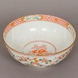 A late 19th century Japanese porcelain bowl Decorated in the round with flowering trees heightened