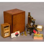 A W Watson & Sons lacquered brass monocular microscope Together with a quantity of various slides.