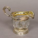 A William IV silver mounted cut glass jug, hallmarked London 1831,