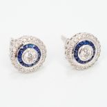 A pair of 18 ct white gold sapphire and diamond earrings Of target form. Each 8mm diameter.