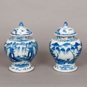 A matched pair of 19th century Chinese blue and white decorated jars Each of squat baluster form,