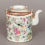 A 19th century Canton famille rose porcelain teapot Of typical cylindrical form,