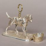 A Victorian silver plated model of a dog Set with a saddle and with loop handle,