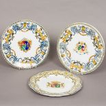 Three 19th century East India Company porcelain plates Each centred with an armorial crest,
