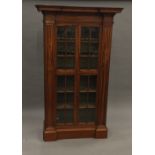An early 19th century satinwood display cabinet Of architectural form,