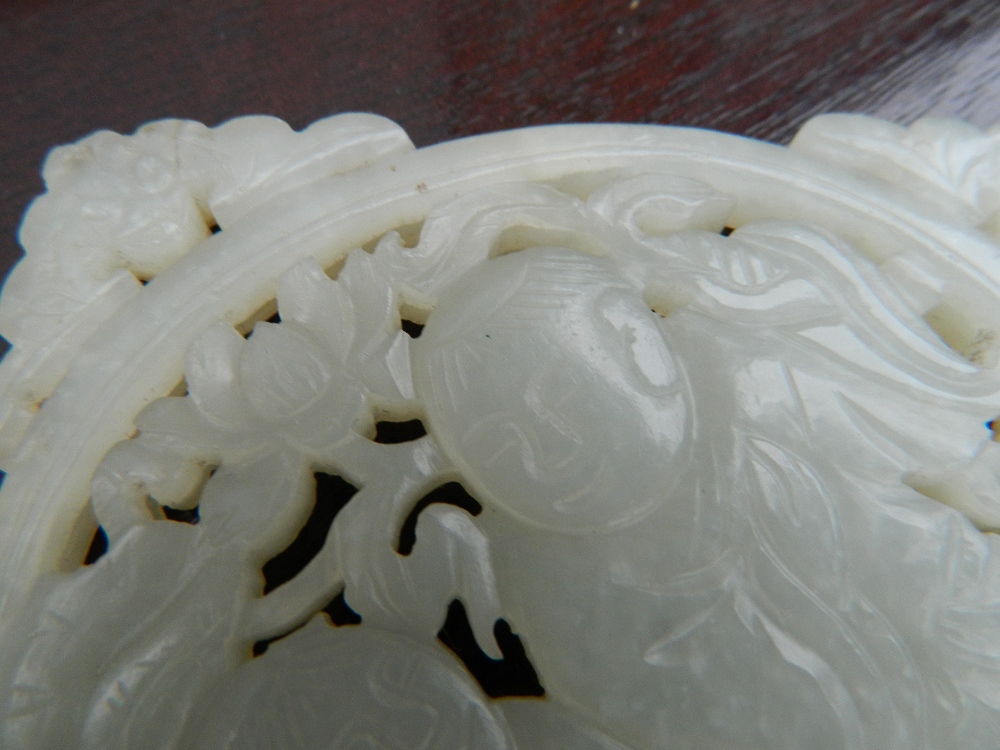 A Chinese pierced and carved jade roundel Centrally decorated with two young boys, - Image 10 of 13