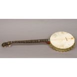 A late 19th century American banjo Of typical form, the reverse stamped for A C Fairbanks & Co,