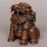 A 19th century Chinese bamboo carving Formed as a Qilin modelled seated. 14 cm high.
