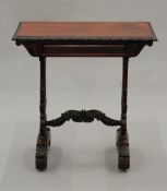 A 19th century Anglo-Indian rosewood side table The rectangular top with acanthus carved edge above