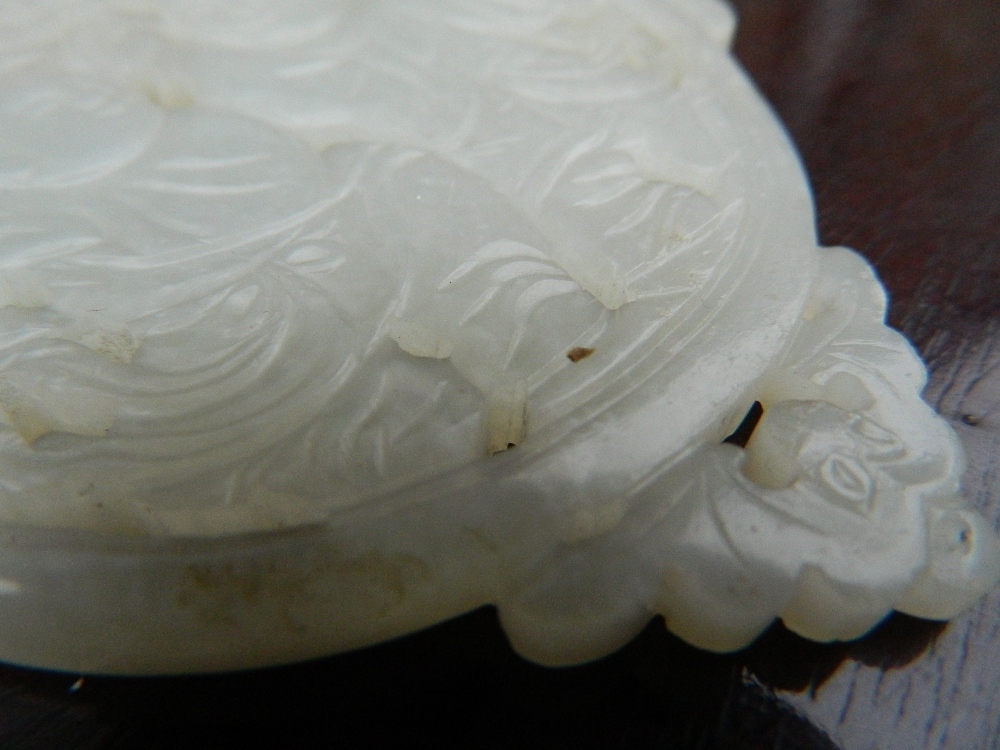 A Chinese pierced and carved jade roundel Centrally decorated with two young boys, - Image 11 of 13