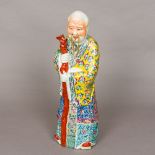 A late 19th/early 20th century Chinese porcelain figure of a sage Modelled wearing colourful robes