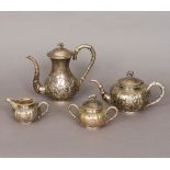 A Chinese three piece silver tea set Together with a Chinese silver coffee pot,