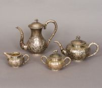 A Chinese three piece silver tea set Together with a Chinese silver coffee pot,