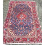 A red and blue ground Hamadan carpet 215 x 130 cm.